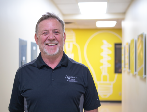 Person smiling in hallway